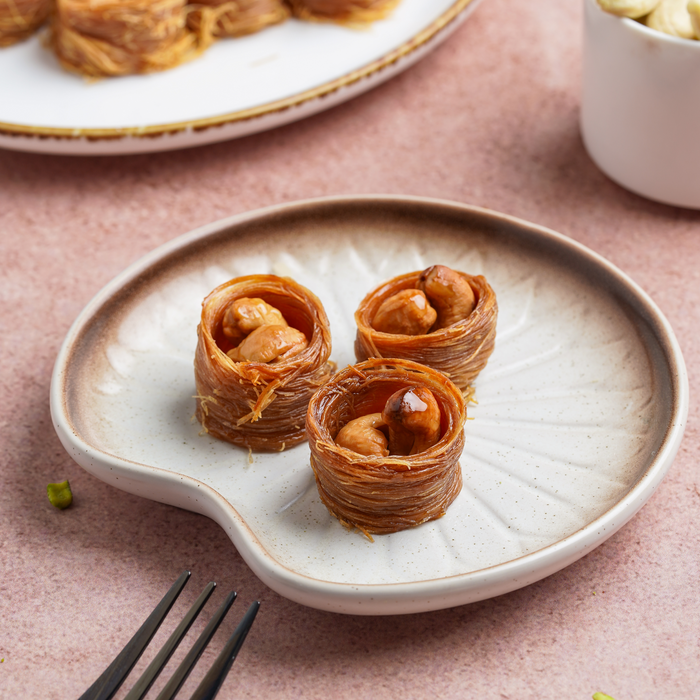 Cashew nest baklava on a white plate