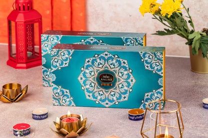 Teal mandala-print Gourmet Baklava gift box with diyas and flowers for Diwali