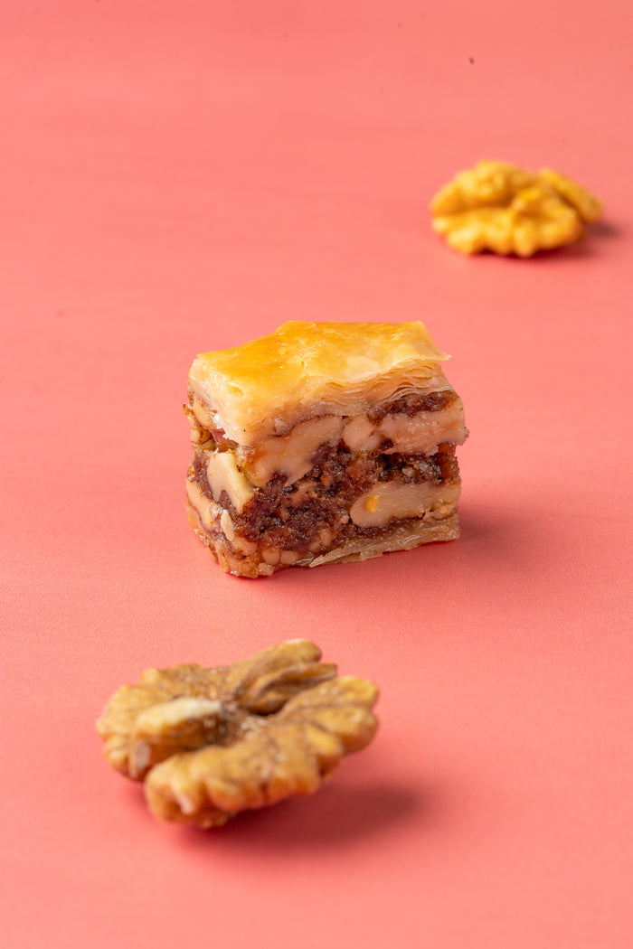 Walnut baklava piece showing layers of walnut and phyllo