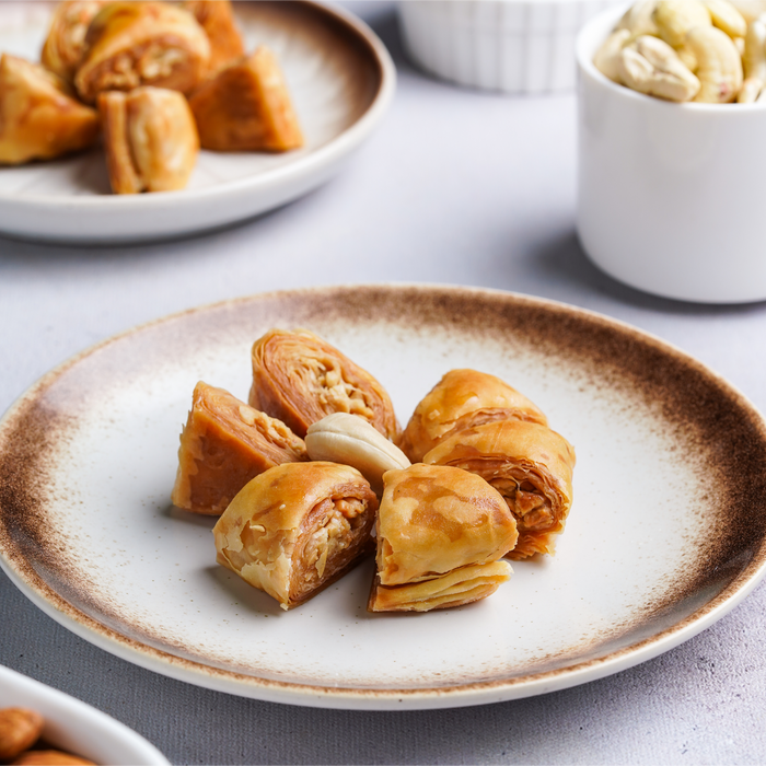 Warbat baklava parcels on a white plate